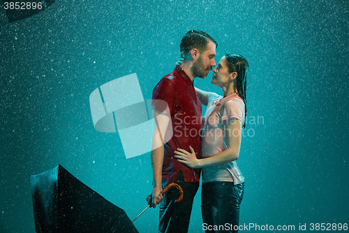 Image of The loving couple in the rain