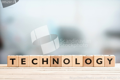 Image of Technology sign on a wooden desk