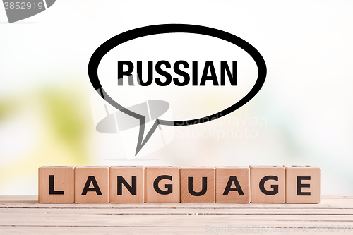 Image of Russian language lesson sign on a table