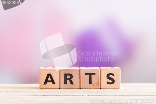 Image of Arts sign on a wooden table