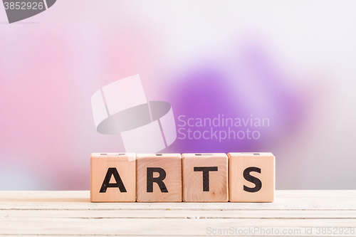 Image of Arts sign on a wooden table