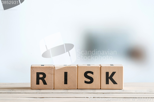 Image of Risk message on a wooden table