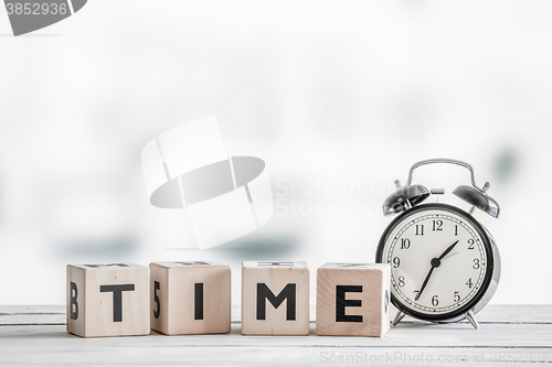 Image of Alarm clock and a the word time