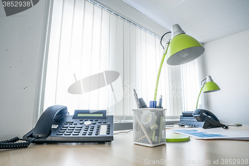 Image of Office desk with a phone