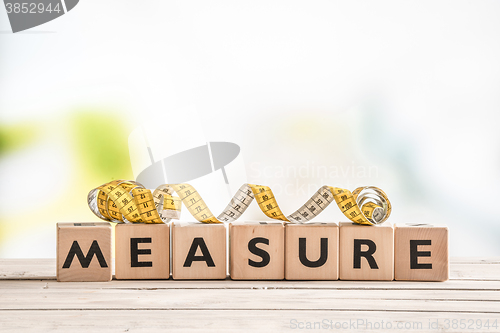 Image of Measure word on a wooden table