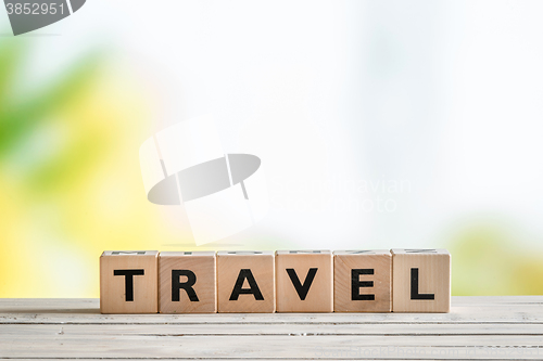 Image of Travel sign on a wooden table