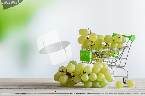 Image of Green grapes in a cart