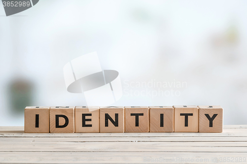 Image of Identity sign on wooden table