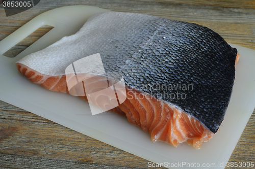 Image of piece of salmon on a cutting board
