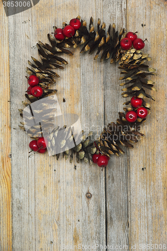 Image of Christmas wreath of cones and berries