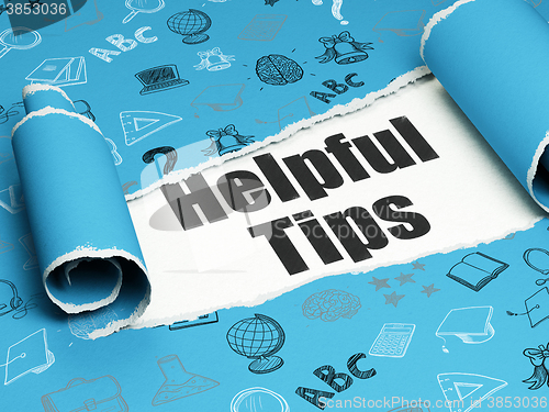 Image of Studying concept: black text Helpful Tips under the piece of  torn paper