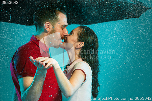 Image of The loving couple in the rain