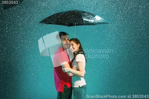 Image of The loving couple in the rain