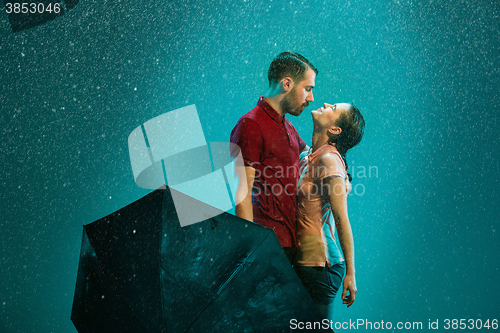 Image of The loving couple in the rain