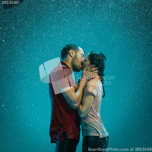 Image of The loving couple in the rain