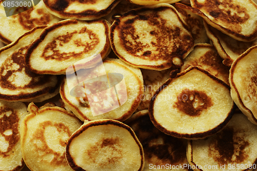 Image of lot of rosy pancakes close up