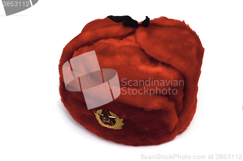 Image of red fur hat with a badge