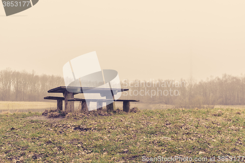 Image of Bench in a park in the mist