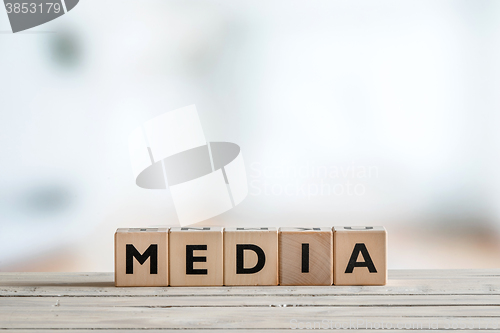 Image of Media sign on a wooden table