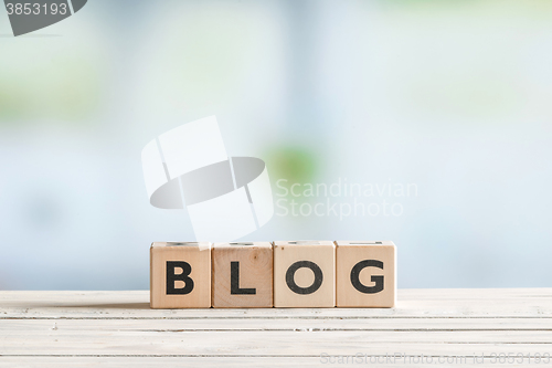 Image of Blog sign on a wooden table