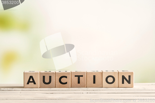 Image of Auction sign on a vintage table