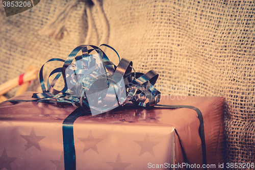 Image of Shiny Xmas gifts with blue ribbon