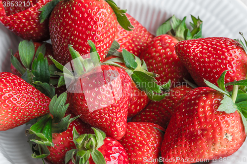 Image of Stack of strawberries in a cup