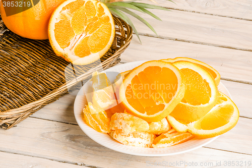 Image of Orange fruit dish on a wooden table