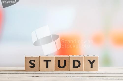 Image of Study sign on a wooden table