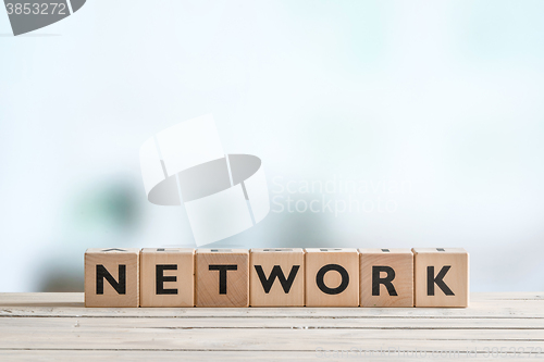 Image of Network sign on a wooden desk