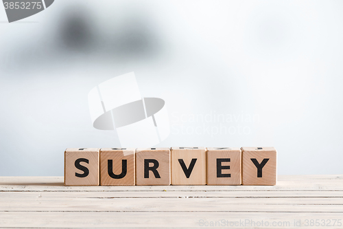 Image of Survey sign on a wooden table