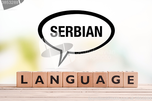 Image of Serbian language lesson sign on a table