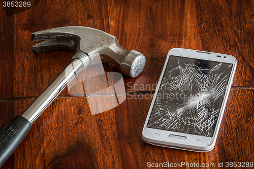 Image of Smashed phone screen on a table
