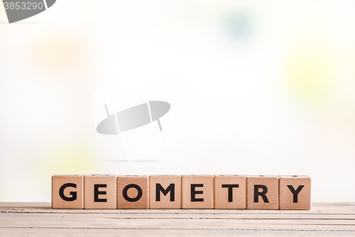 Image of Geometry lessons sign on a table