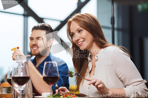 Image of happy couple having dinner at restaurant