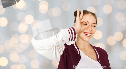 Image of happy teenage girl making face and having fun