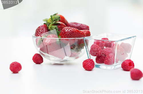 Image of close up of ripe red strawberries and raspberries