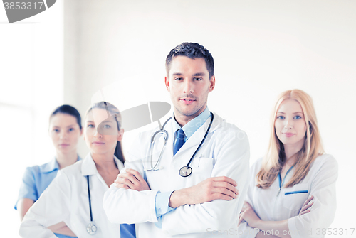 Image of male doctor in front of medical group