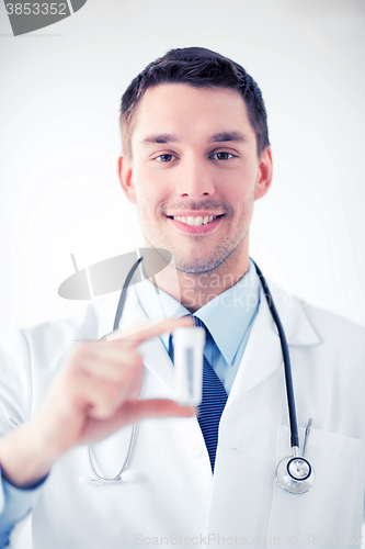 Image of young male doctor with empty test-tube