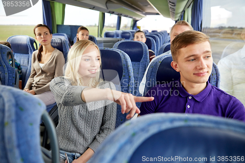 Image of group of tourists in travel bus