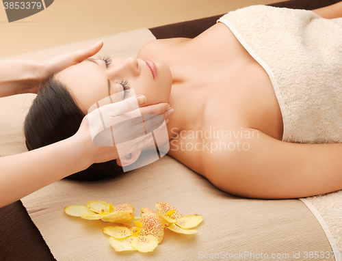 Image of beautiful woman in massage salon