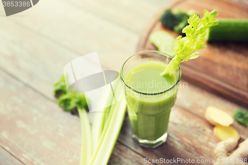 Image of close up of fresh green juice glass and celery