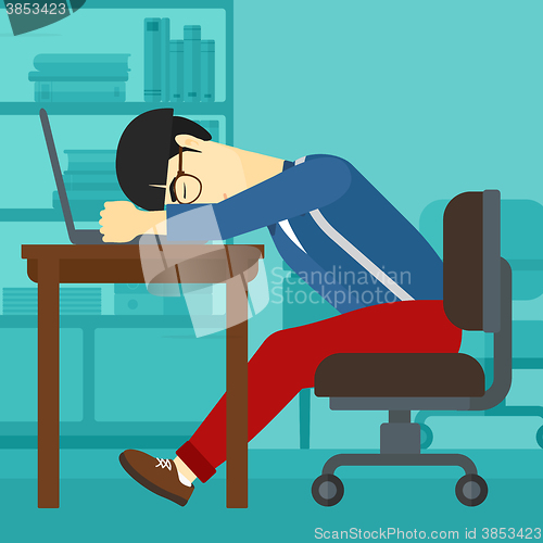 Image of Man sleeping on workplace.