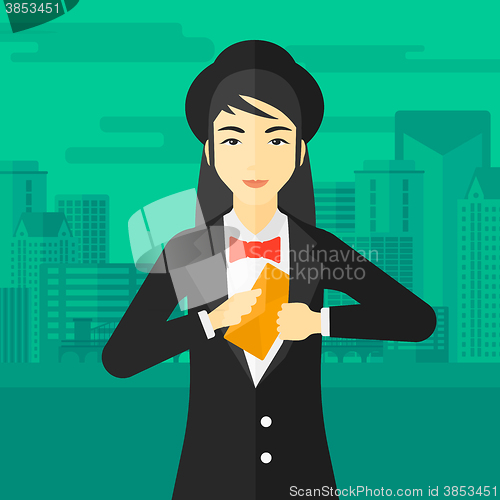 Image of Woman putting envelope in pocket.