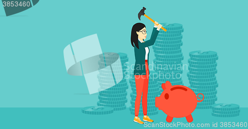 Image of Woman breaking piggy bank.