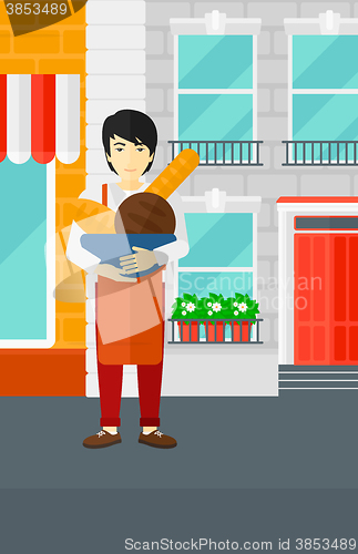Image of Bakery owner with bread.