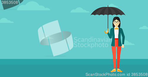 Image of Business woman standing with umbrella.