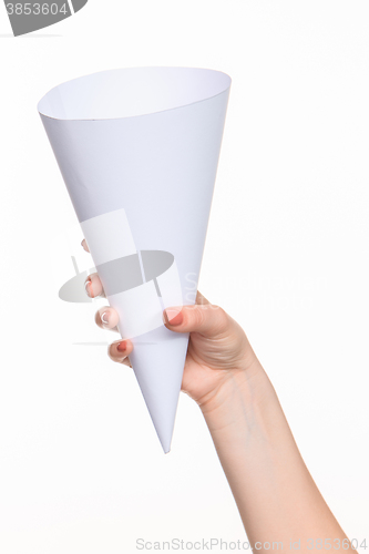 Image of The cone in female hands on white background