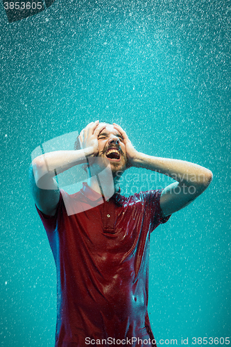 Image of The portrait of young man in the rain