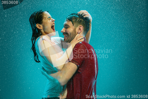 Image of The loving couple in the rain